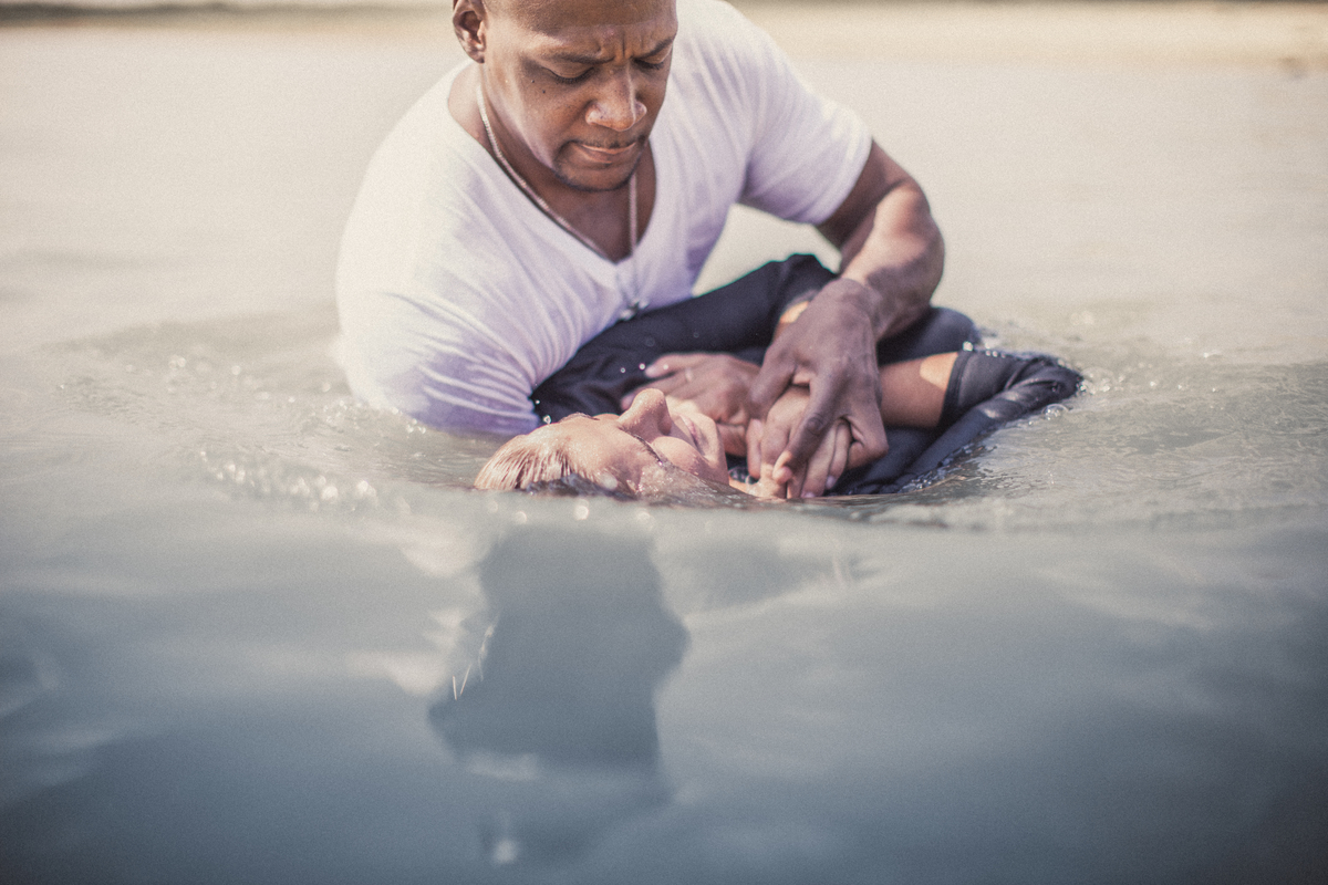 Person being baptised in water