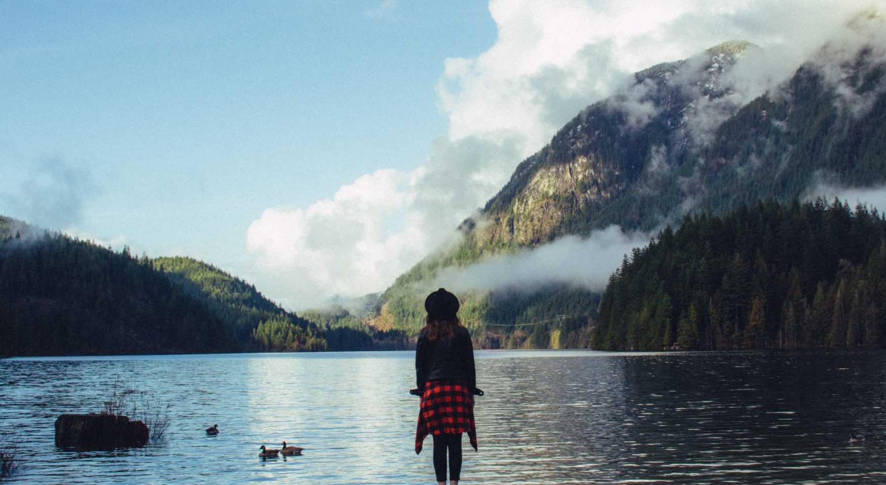 girl-plaid-gazing-water-mountains