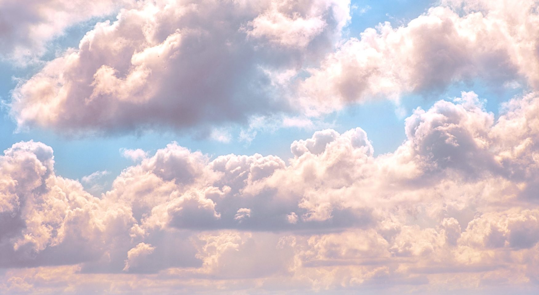 Luminous clouds set against a sunny sky