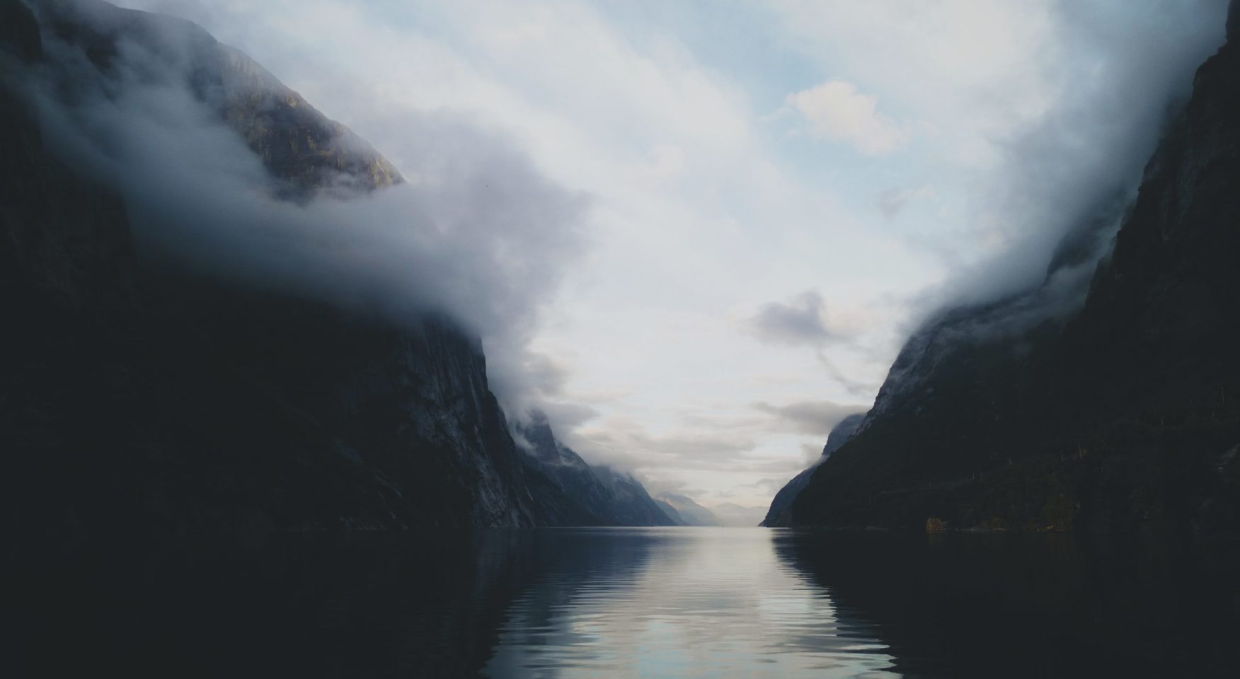 River winding through misty mountain pass