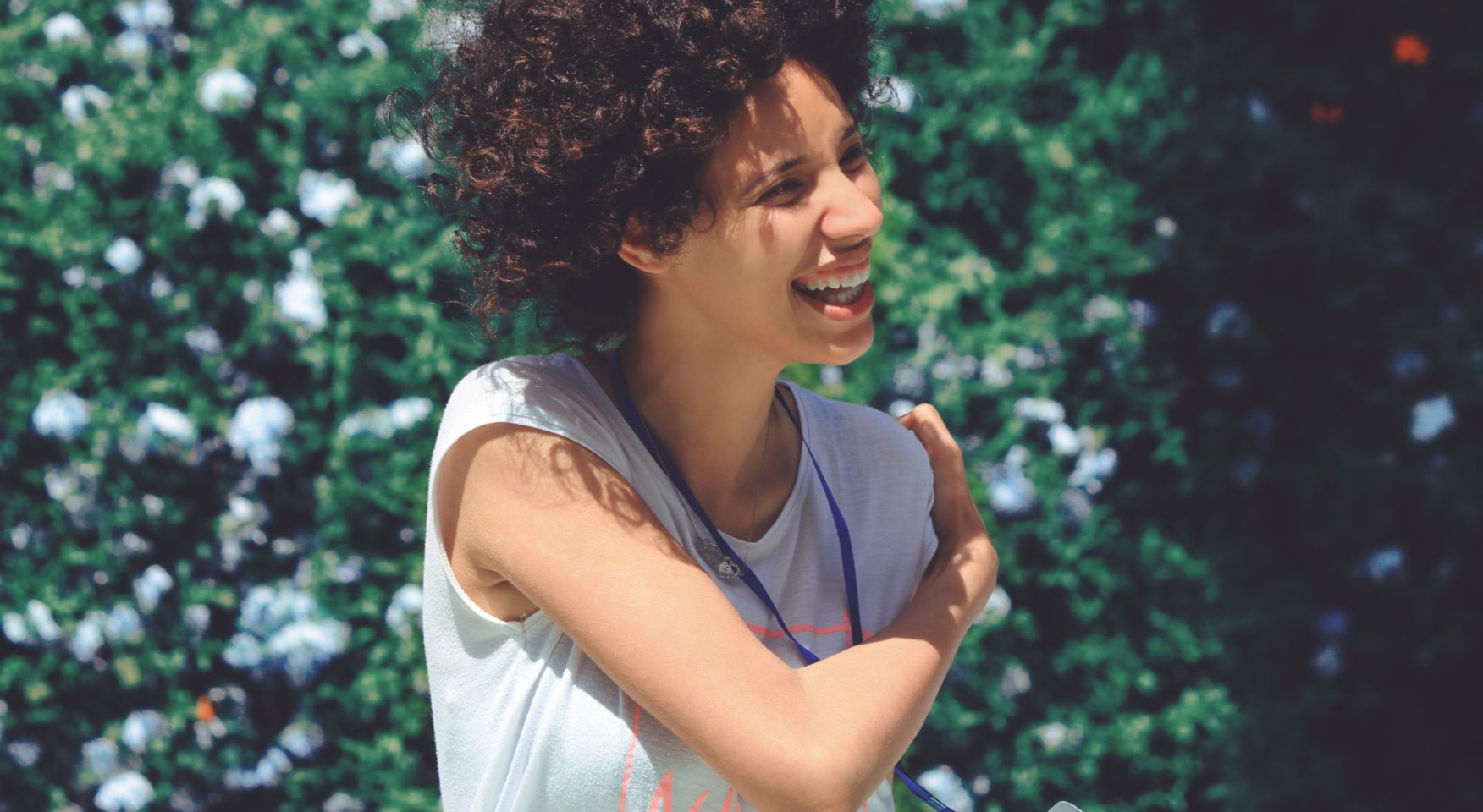 Smiling woman with curly brown hair